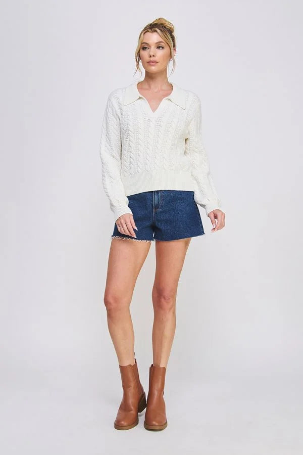 White cable knit Johnny collar pullover sweater styled with denim shorts and brown ankle boots