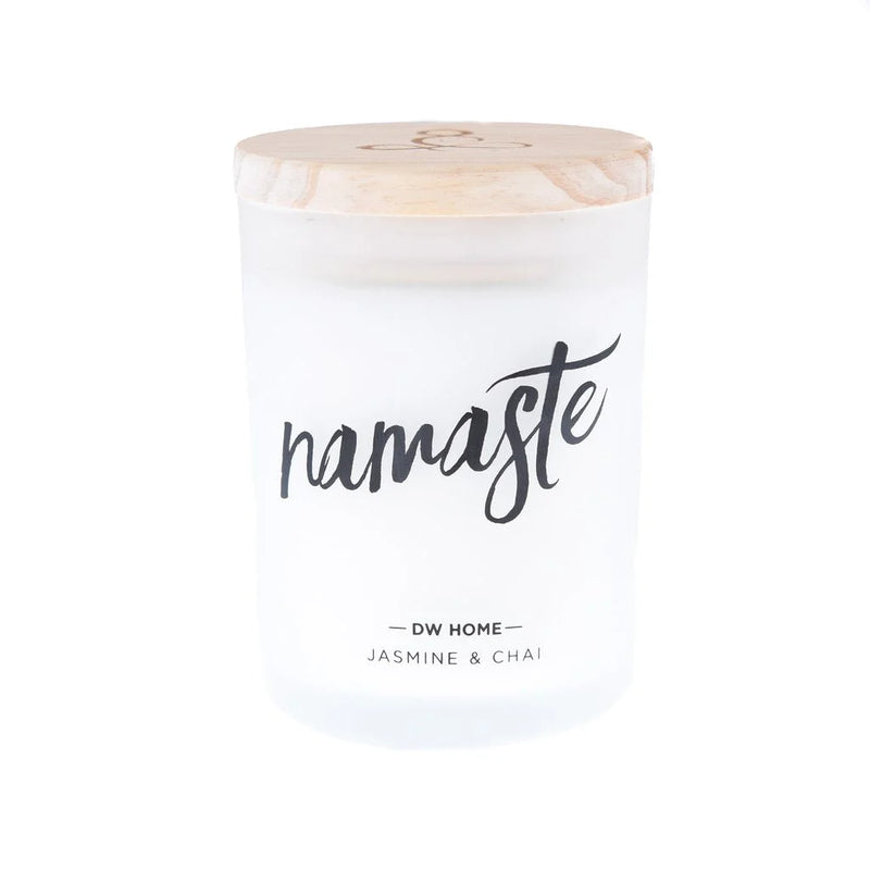 White Namaste Candle with blooming jasmine flowers displayed on Daisy Lane