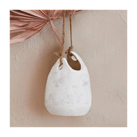 White ceramic hanging coarse stoneware planter with jute rope hanger in teardrop shape