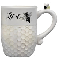 White ceramic bee mug with honeycomb pattern and Let it Bee design featuring a bee