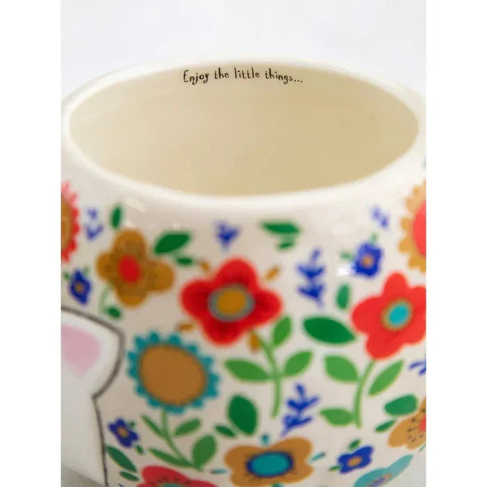 White ceramic mug with colorful floral patterns from Hedgehog Folk Art, ideal for boho chic styles