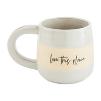 White ceramic mug with love this place text on beige stripe for women’s boho chic clothing