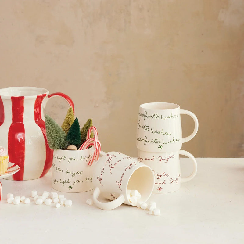 Cream color ceramic mugs with handles and printed script for women’s boho chic clothing at Shop Daisy