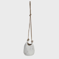 White ceramic hanging coarse stoneware planter with jute rope hanger