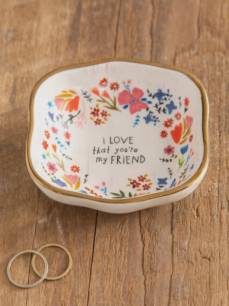 White ceramic antiqued trinket bowl with colorful floral pattern and gold rim