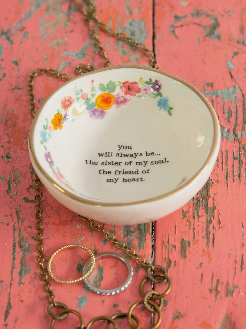 White ceramic giving trinket bowl with floral rim, ideal for jewelry or keepsakes