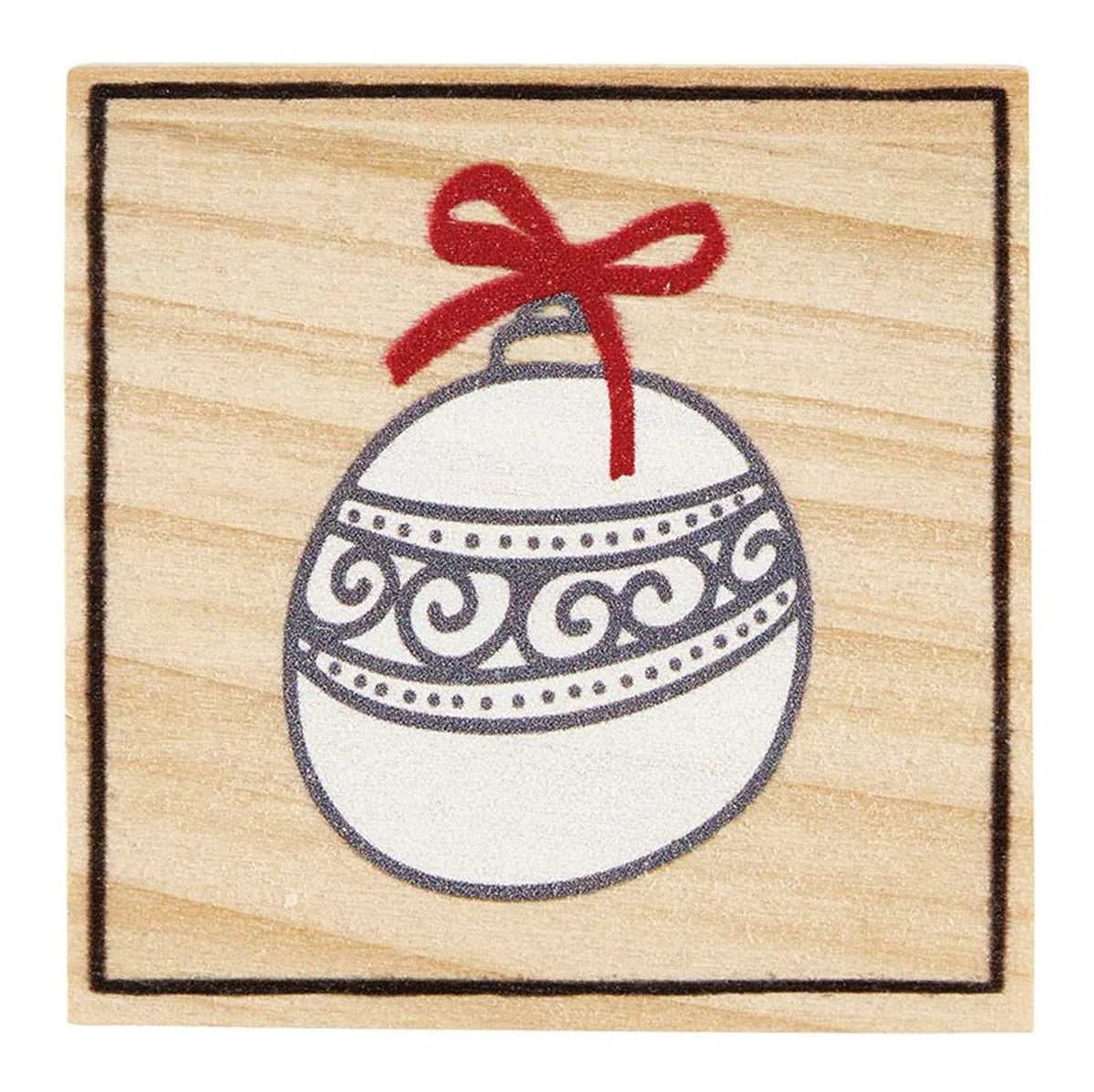 Elegant white Christmas ornament with swirls and a red bow, enhancing snowflake shaped earrings