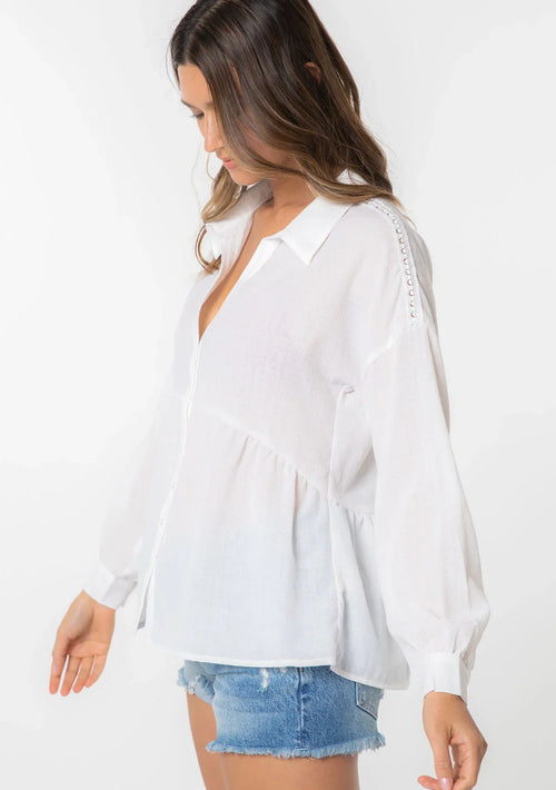 Bohemian long sleeve tiered blouse with v-neck and distressed denim shorts