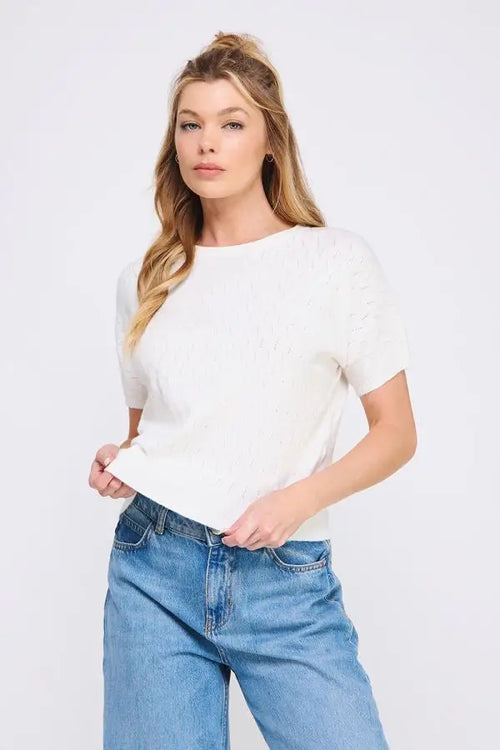 White short sleeve dolman t-shirt with pointelle pattern styled with blue denim jeans