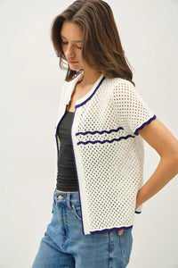 White crochet knit open cardigan with navy trim, perfect for women’s boho clothes