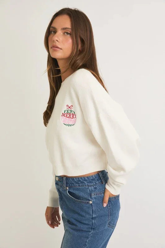 White cropped sweatshirt with red logo, perfect for a Round Neck Merry Christmas sweater