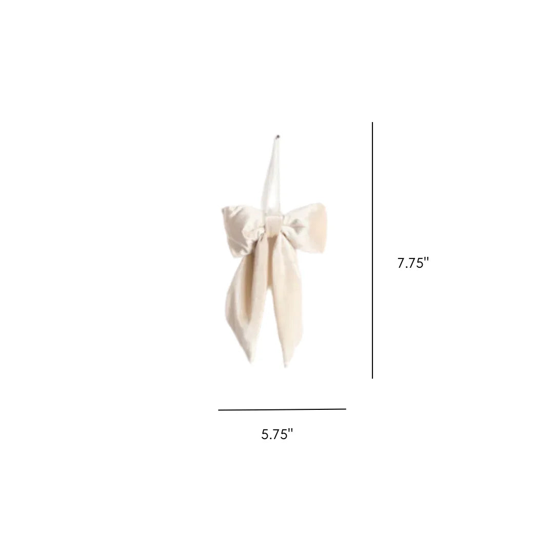 Velvet fabric bow with white cross, beige ribbon, and tassel