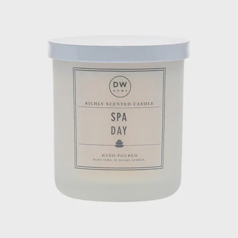 White DW Spa Day scented candle in cylindrical container for women’s boho chic clothing