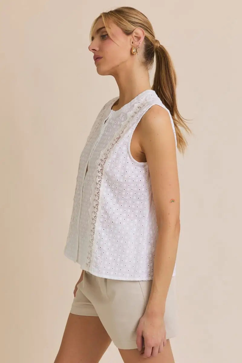White eyelet sleeveless top from Round Neck Lace Trim Detail Button Up Eyelet Top, perfect for women’s boho chic clothing from Shop Daisy