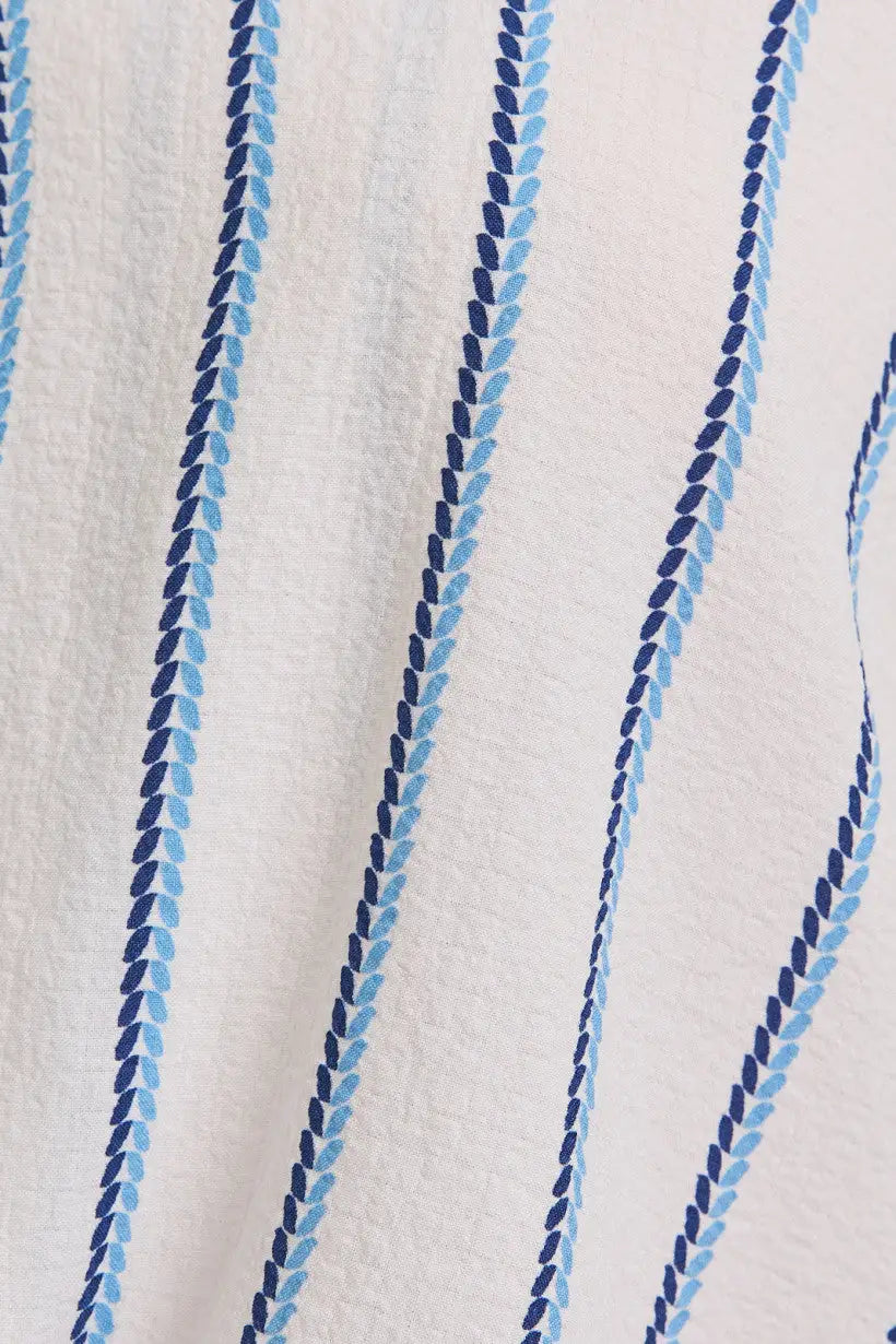 White fabric with blue striped pattern on a V-Neck Folded Short Sleeve Stripe Blouse