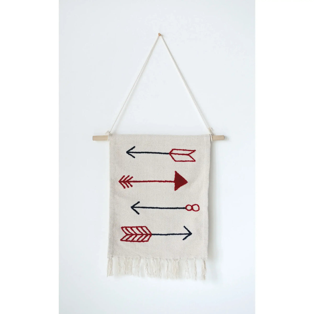 White cotton wall hanging with red and black arrow designs and fringe details