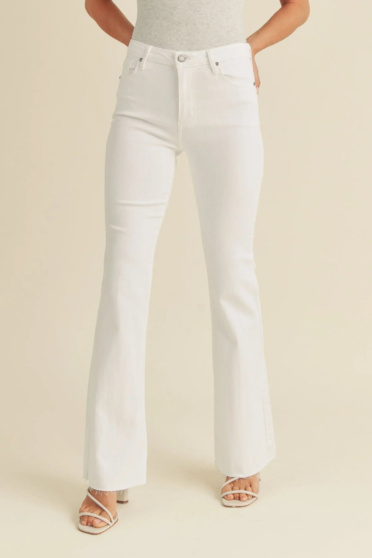 White Mid Rise Flare Denim Jeans featuring a stylish high-rise waist for a modern look