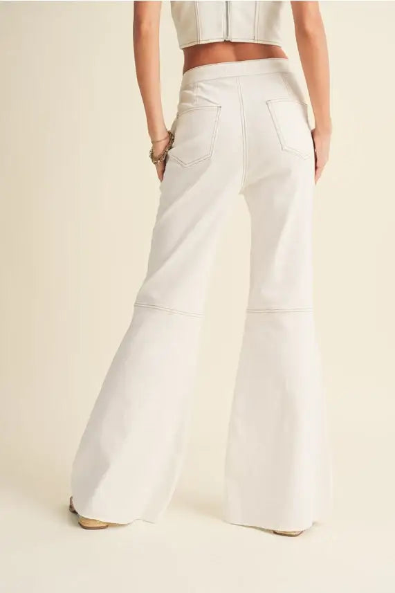 White flared jeans from Shop Daisy in soft stretched cotton for women’s boho chic clothing