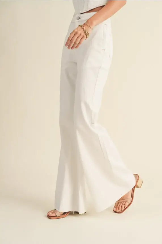 White flared pants from Shop Daisy, featuring stretched cotton for women’s boho chic clothing