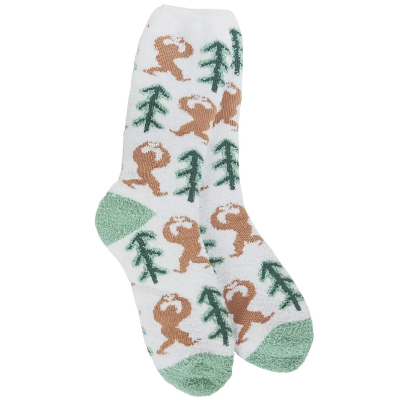 White fuzzy Sasquatch Holiday Cozy Crew socks with sloth and tree design