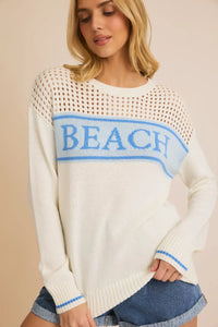 White knit ROUND NECK LONG SLEEVE BEACH SWEATER featuring ’BEACH’ text for stylish wear