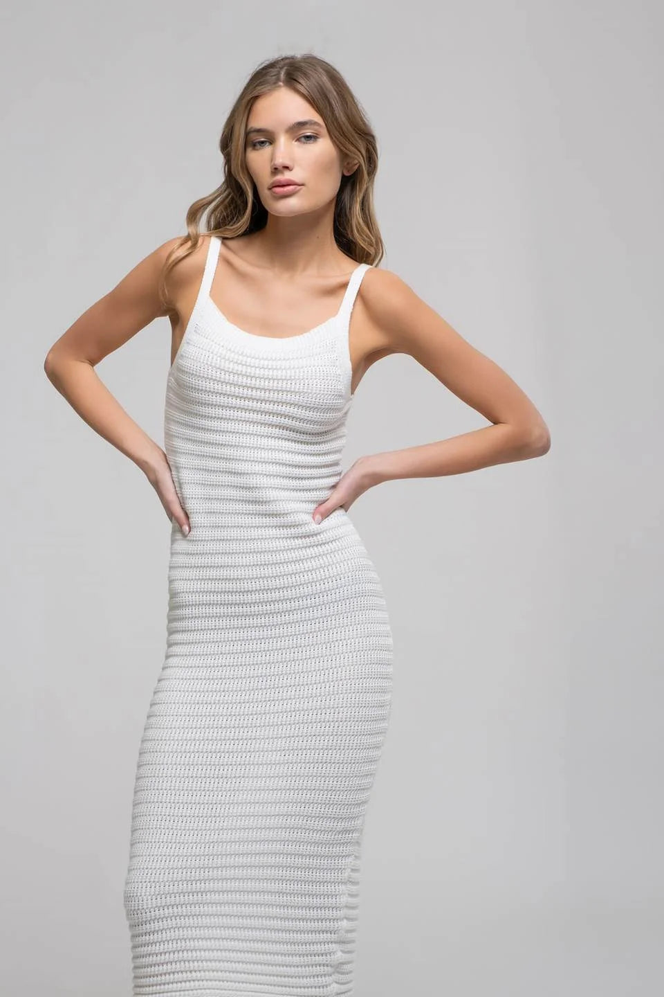 White knitted cami midi dress featuring thin shoulder straps, perfect for stylish occasions