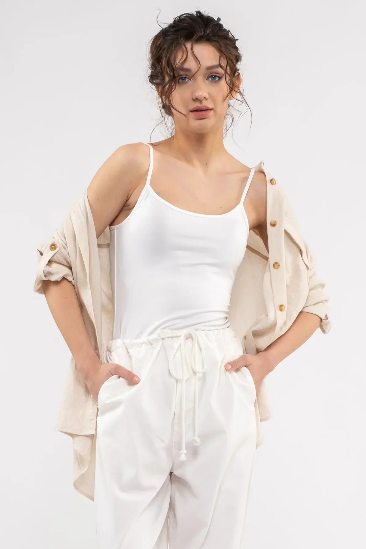 White linen jumpsuit with spaghetti straps and beige cardigan for women’s boho chic clothing