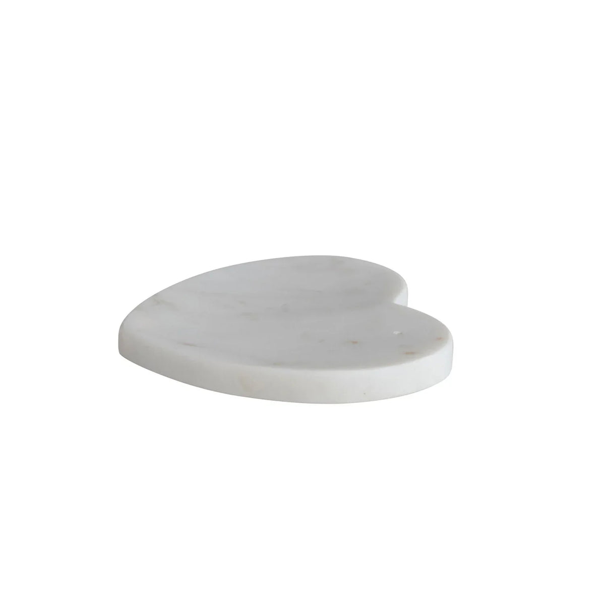 White marble heart shaped dish elegantly displaying a unique marble heart object