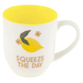 White Squeeze The Day Mug with yellow lid and lemon, perfect for a boho style