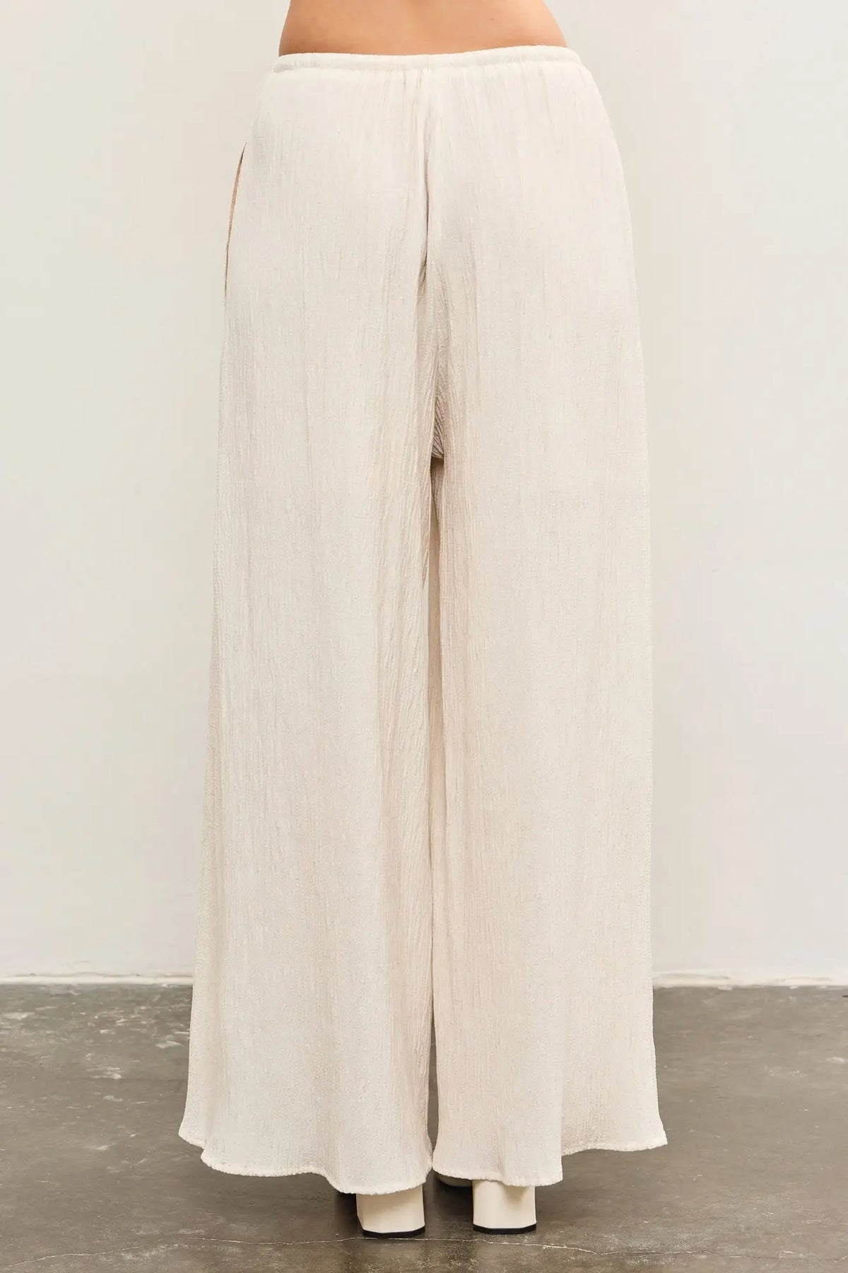 Flowing white wide leg pants from ELASTIC WAIST WIDE LEG PANTS collection