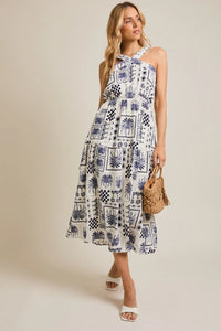 White patterned halter neck abstract print dress showcasing elegant summer fashion