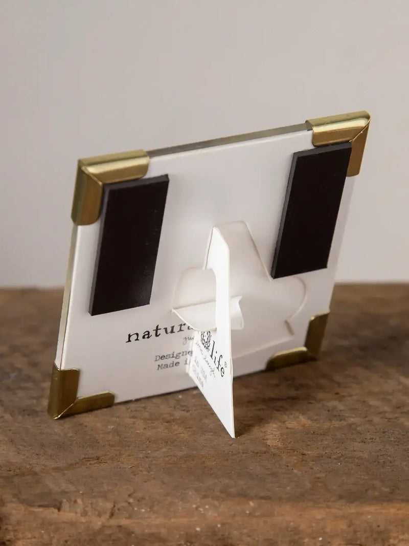 White photo frame with gold corners and magnet backing for women’s boho chic clothing display