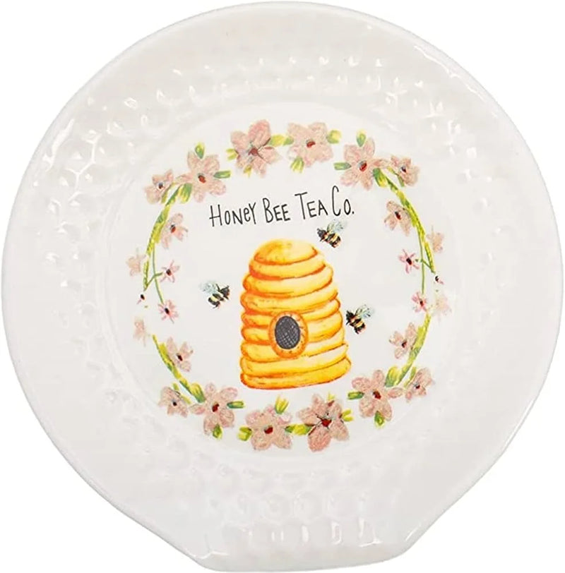 White plate with honeycomb beehive design showcasing honeycomb spoon rest theme