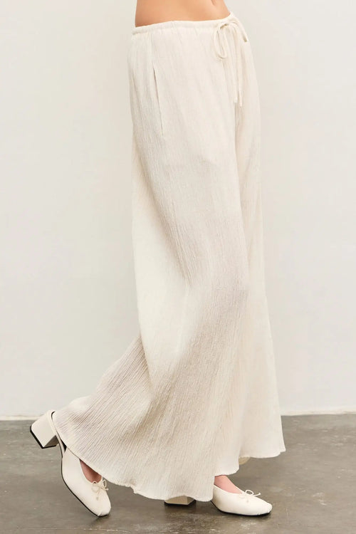 Flowing white pleated wide leg pants from ELASTIC WAIST WIDE LEG PANTS collection