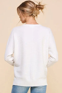 White ribbed knit sweater in soft mixed texture, featuring a casual fit and dolman sleeves