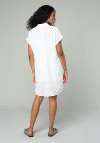 White short-sleeved shirt dress on a woman, perfect for a boho free spirit style