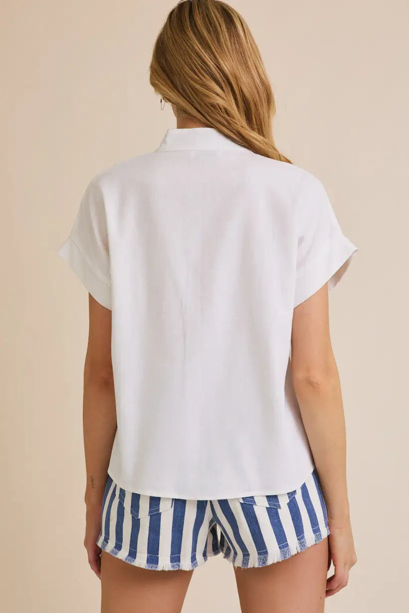 White short sleeve flare blouse with blue and white striped shorts for casual style