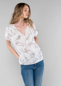 White floral short dolman blouse with short dolman sleeve and button front detail