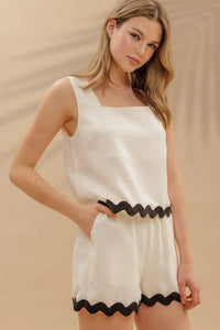 White top and shorts set with contrast wavy hem trim for stylish summer wear
