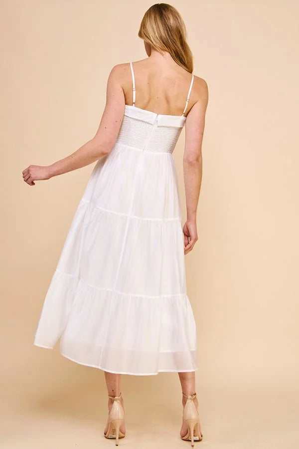 White sleeveless soft tiered maxi dress with spaghetti straps showcased from the back