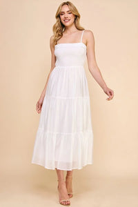 White sleeveless soft tiered maxi dress with smocked bodice and flowy skirt