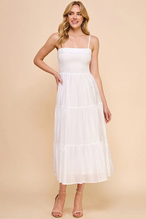 White sleeveless soft tiered maxi dress with fitted bodice and flowy skirt design