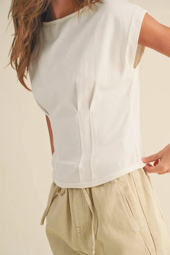 White sleeveless Corset Style Body top with light drawstring pants for a stylish look