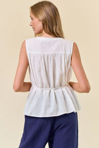 White sleeveless boho chic top with tie waist, perfect for women’s boho clothes at Shop Daisy