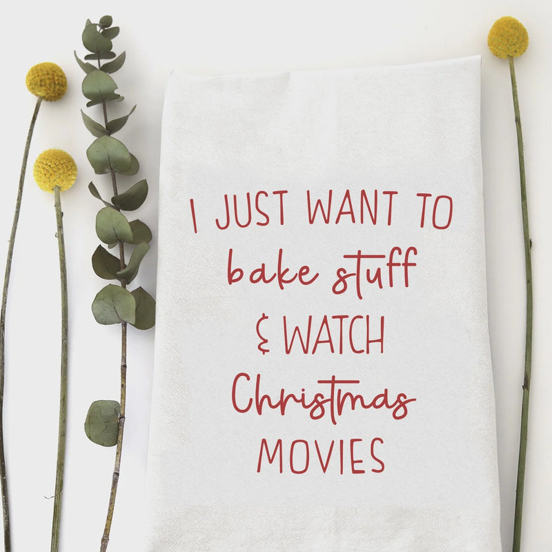 White square kitchen towel with red handwritten desire to bake and watch Christmas movies