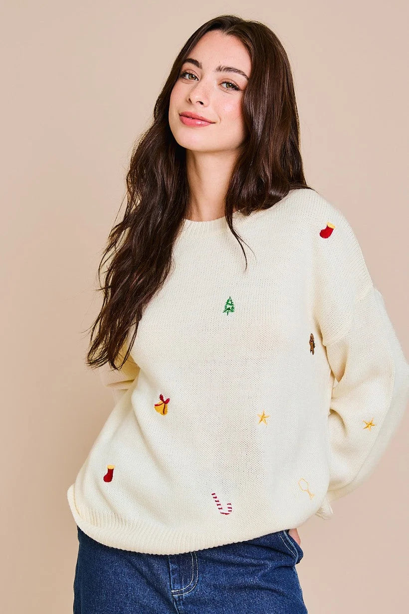 White long sleeve embroidered sweater with colorful designs and round neck style