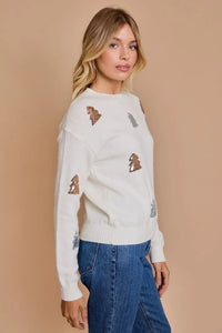 White sweater with dog pattern embroidery, part of Shop Daisy’s women’s boho chic clothing