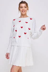 White sweater dress featuring soft fine raised hearts in a charming design