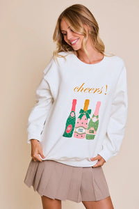 White Cheers Graphic Sweatshirt with colorful wine bottle designs and orange script