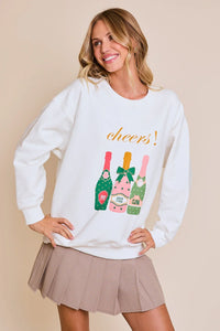 White Cheers graphic sweatshirt with colorful champagne bottles design for festive occasions